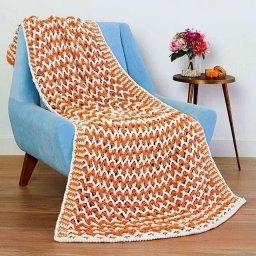 ​Плед крючком из белой и оранжевой пряжи: уют и тепло своими руками